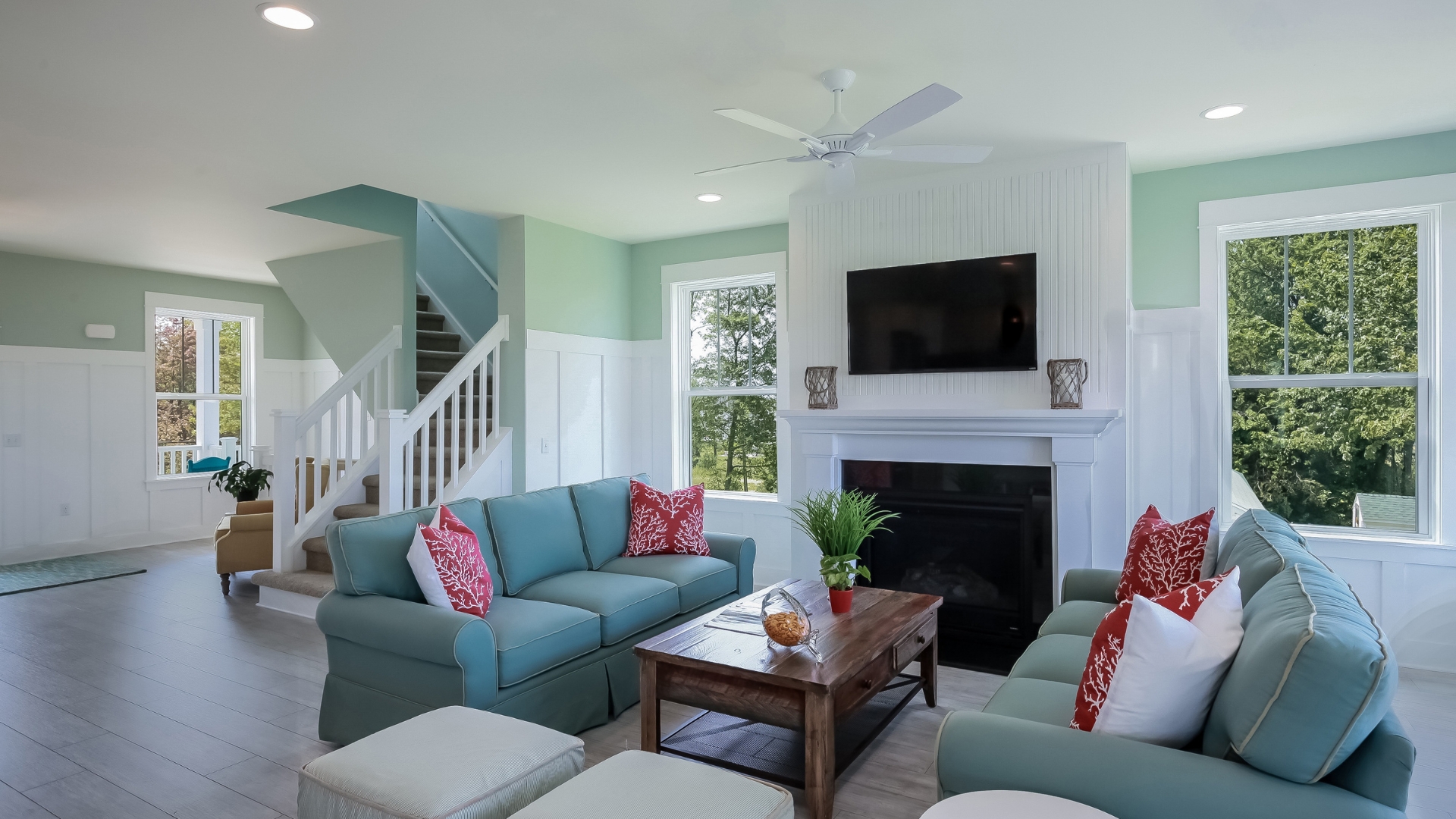 A living room filled with furniture and a fire place