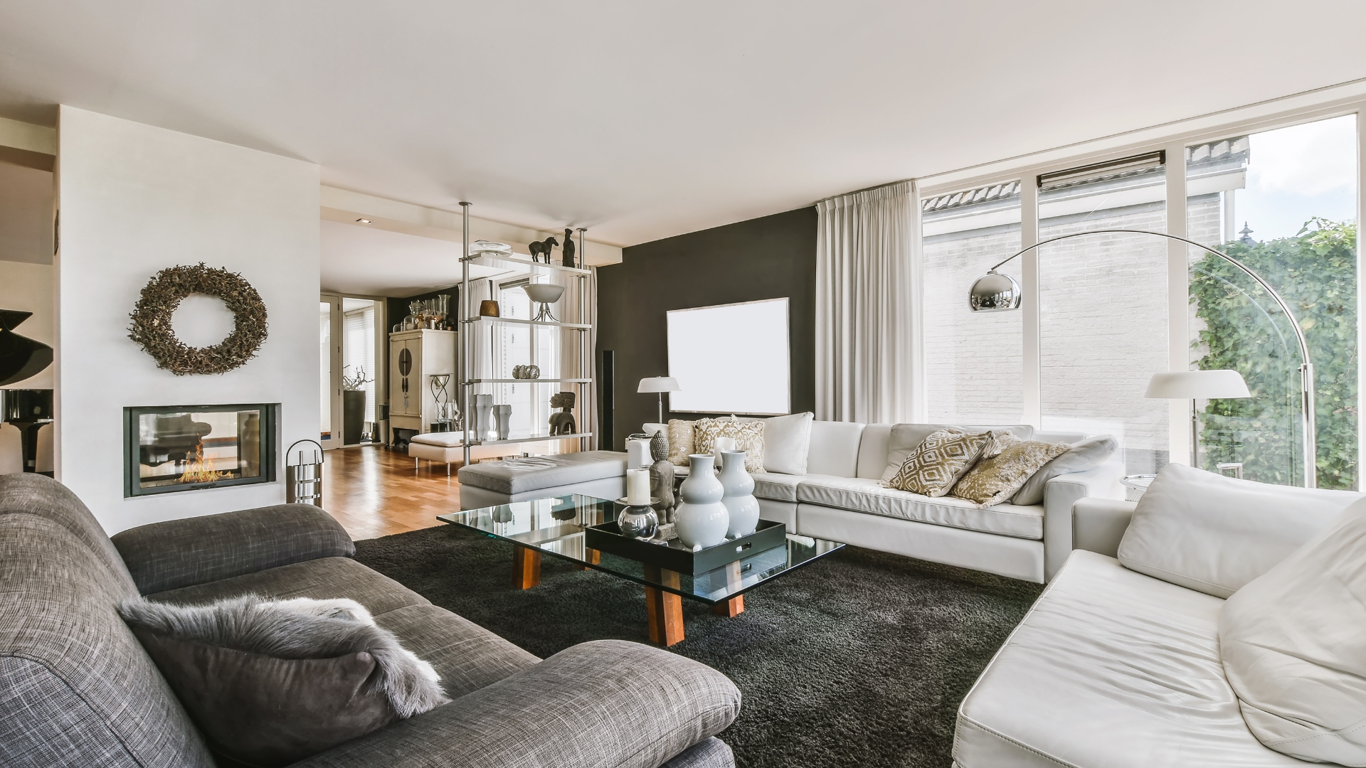 A living room filled with furniture and a fire place